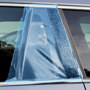 Smashwrap adhesive film covering broken car window