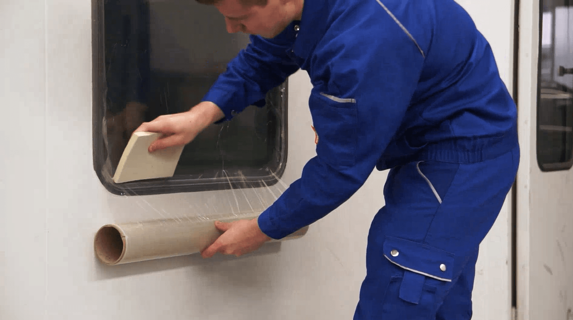 applying self adhesive glass protection film with squeegee