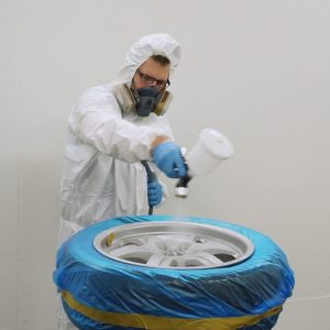 Spray painting an alloy wheel fitted with Wondermask WPS wheel masking film