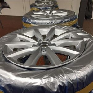 Four alloy wheels painted using Wondermask WPS masking film for tyre protection during paint process
